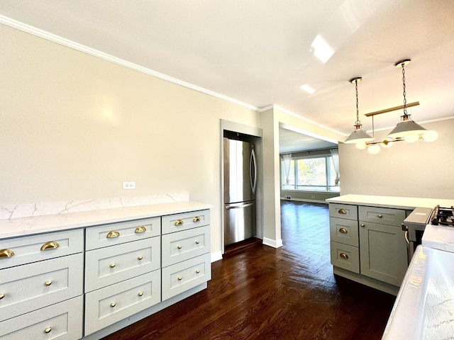 kitchen with crown molding, hanging light fixtures, stainless steel refrigerator, dark hardwood / wood-style flooring, and gray cabinets