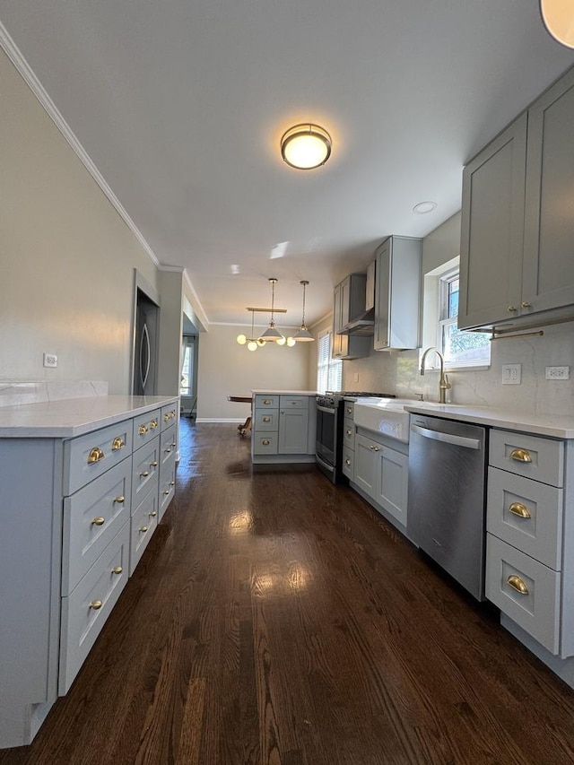 kitchen featuring gray cabinets, appliances with stainless steel finishes, dark wood-type flooring, and wall chimney exhaust hood