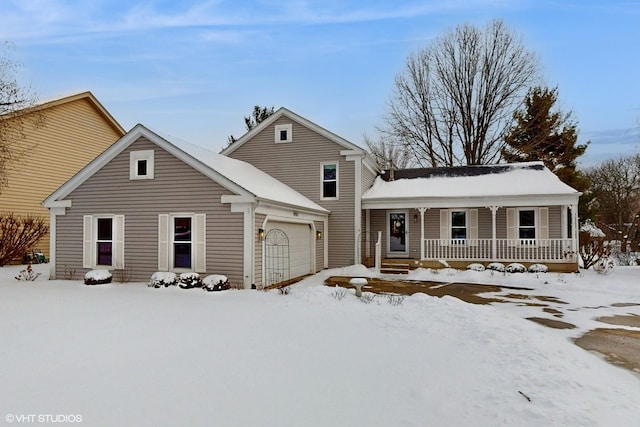 view of front property featuring covered porch and a garage