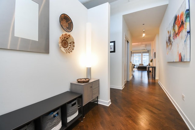 hall with dark hardwood / wood-style floors