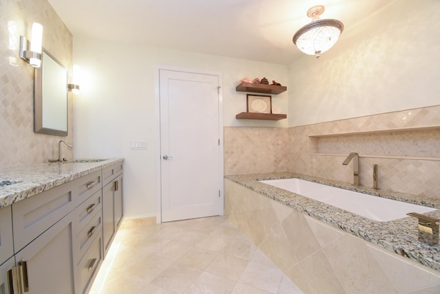 bathroom featuring tasteful backsplash and vanity