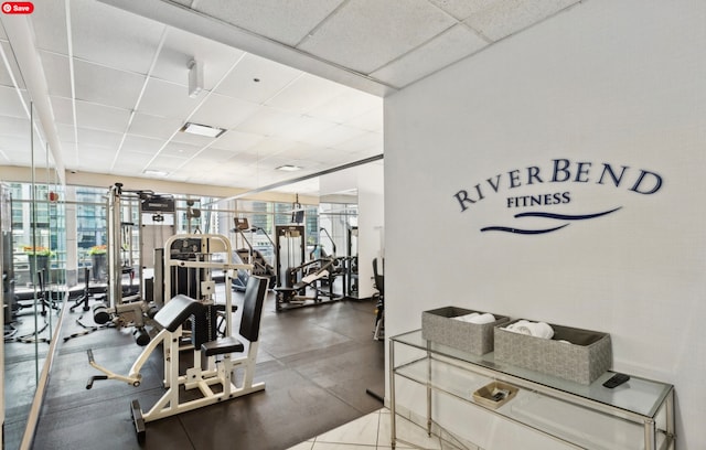 workout area with a paneled ceiling