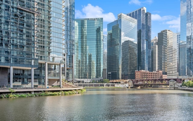 property's view of city featuring a water view