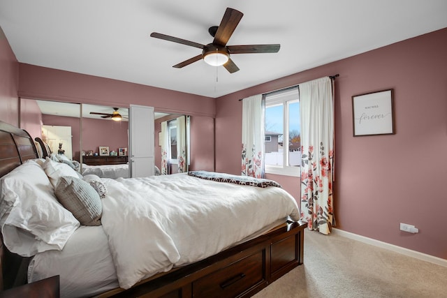 carpeted bedroom with ceiling fan