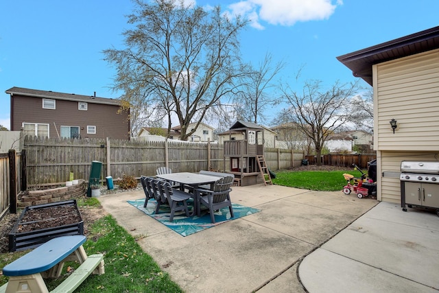 view of patio featuring grilling area and a playground