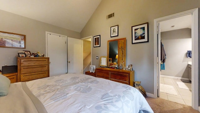 803 Irvine Rd Unit 803, Champaign, IL 61822 - bedroom with light colored carpet, high vaulted ceiling, connected bathroom, and light tile patterned floors