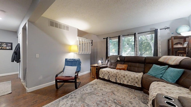 803 Irvine Rd Unit 803, Champaign, IL 61822 - living room with a textured ceiling, wood finished floors, and lofted ceiling