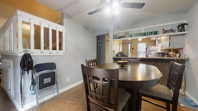 803 Irvine Rd Unit 803, Champaign, IL 61822 - dining area with a ceiling fan and wood finished floors
