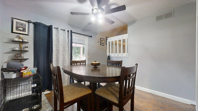 803 Irvine Rd Unit 803, Champaign, IL 61822 - dining room with a textured ceiling, ceiling fan, and wood finished floors