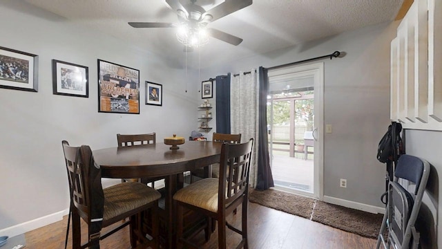 803 Irvine Rd Unit 803, Champaign, IL 61822 - dining room featuring ceiling fan, wood finished floors, and a textured ceiling