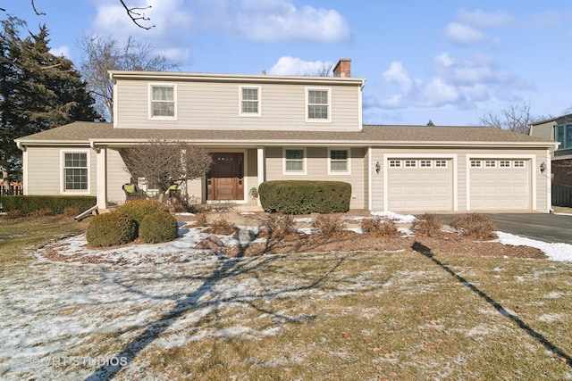 front of property with a garage