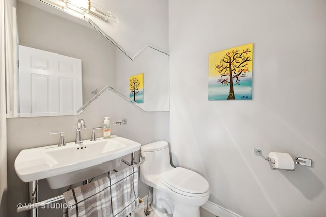 bathroom with sink and toilet