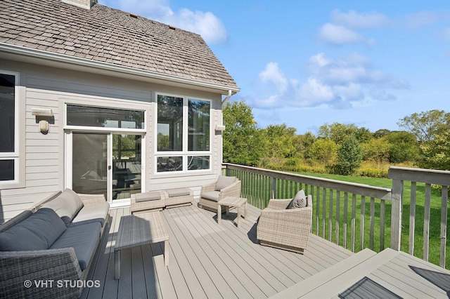 deck with an outdoor hangout area and a lawn