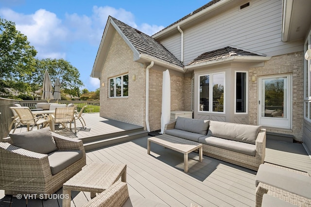 wooden deck featuring outdoor lounge area