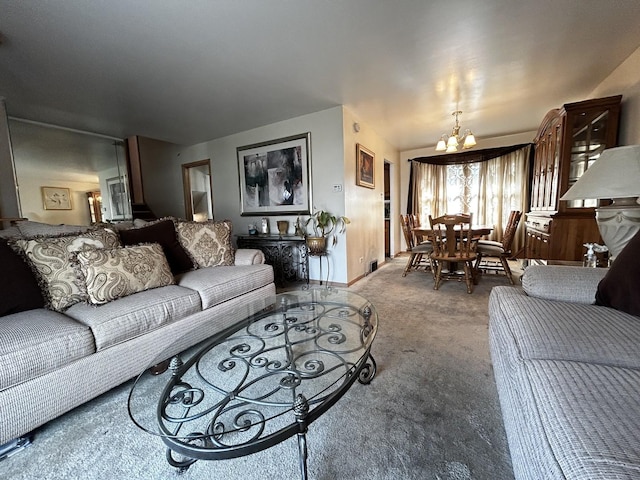 carpeted living room with a chandelier