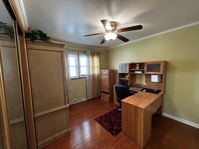 office space with dark wood-style flooring, visible vents, ornamental molding, a ceiling fan, and baseboards