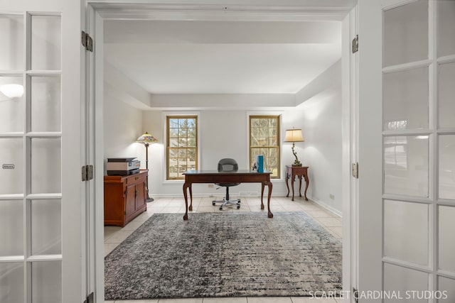 office with light tile patterned floors and baseboards