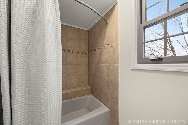 full bathroom featuring shower / bath combination with curtain, a healthy amount of sunlight, and ornamental molding