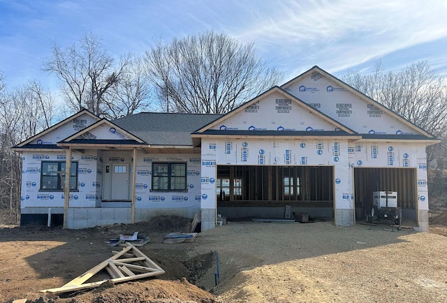 unfinished property featuring a garage