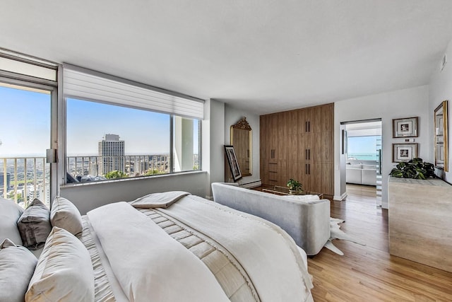 bedroom with light wood-type flooring