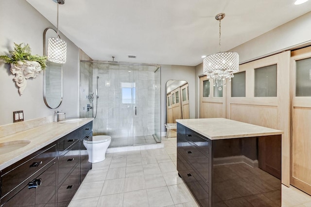 bathroom featuring a notable chandelier, vanity, an enclosed shower, and toilet