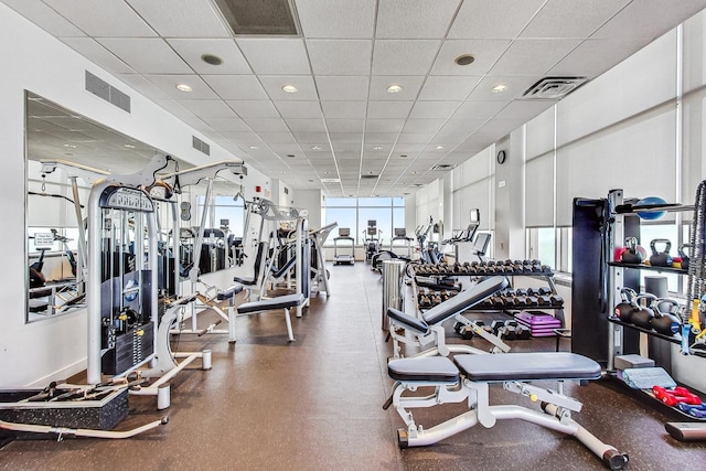 workout area featuring a drop ceiling