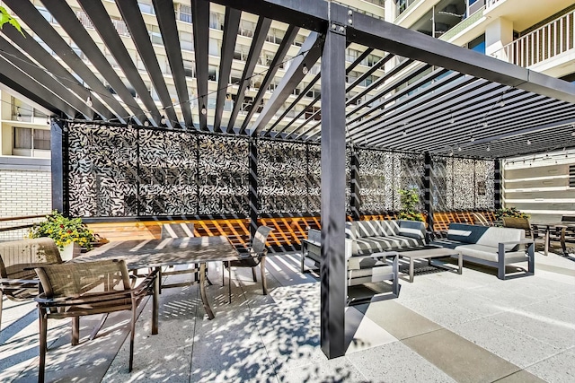 view of patio with an outdoor living space and a pergola