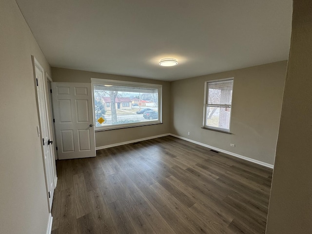 unfurnished bedroom featuring dark wood-type flooring