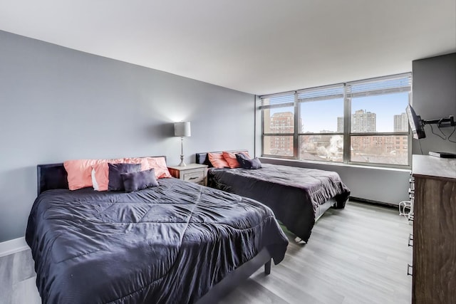 bedroom with light wood-type flooring