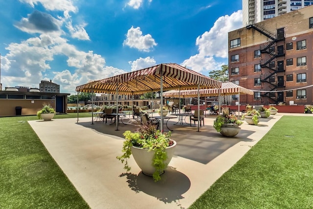 surrounding community featuring a gazebo and a yard