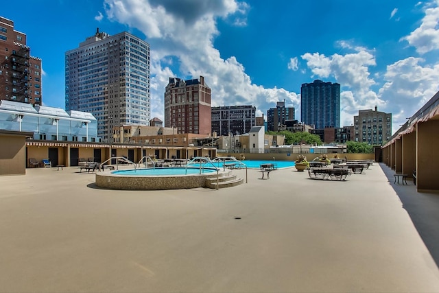 view of pool featuring a patio