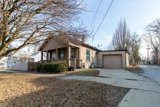 view of front of property featuring a garage and a porch