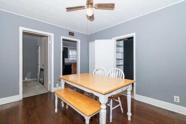 dining space featuring dark hardwood / wood-style floors and ceiling fan