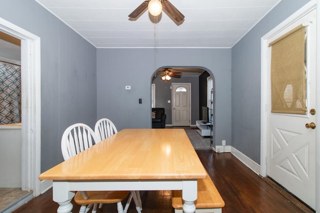 dining area featuring ceiling fan and dark hardwood / wood-style floors