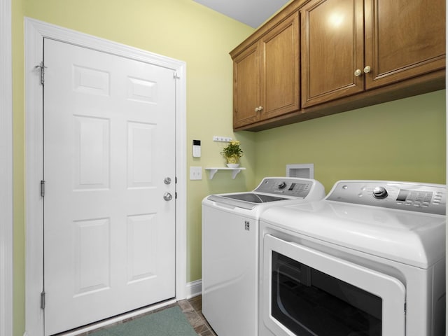 washroom with cabinets and independent washer and dryer