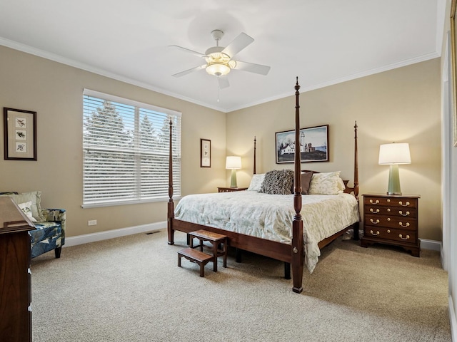 carpeted bedroom featuring crown molding and ceiling fan