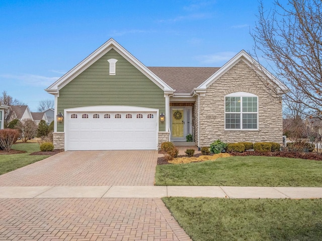 ranch-style home featuring a garage and a front yard