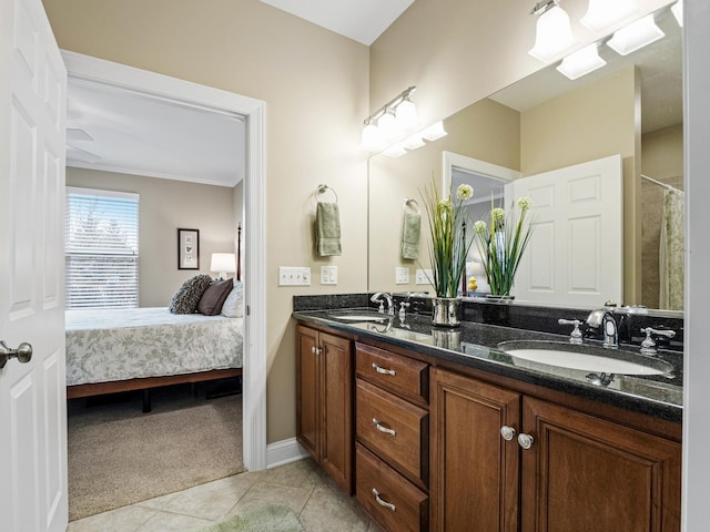 bathroom featuring tile patterned flooring and vanity