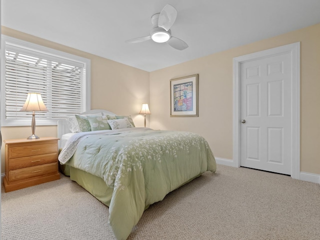 bedroom with ceiling fan and light colored carpet