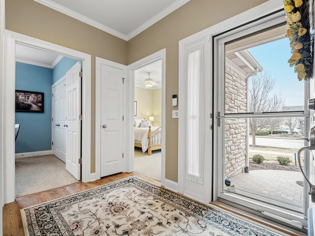 entryway featuring light hardwood / wood-style flooring and ornamental molding