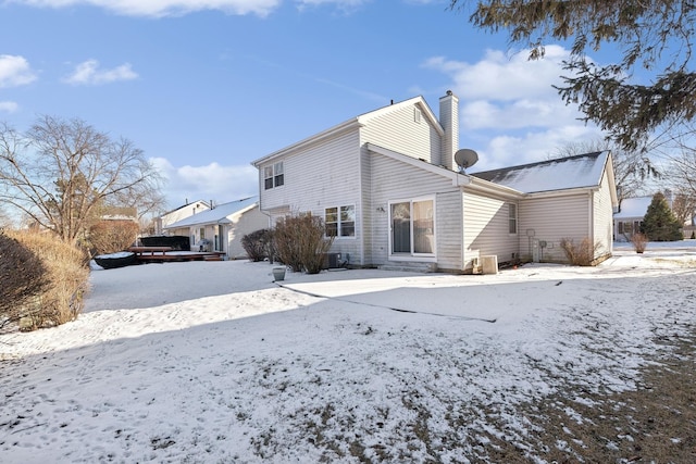 view of snow covered house