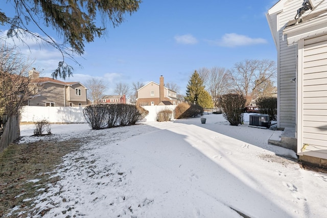 view of yard layered in snow