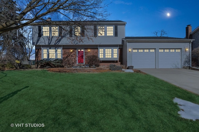 colonial inspired home with a garage, a front lawn, and concrete driveway