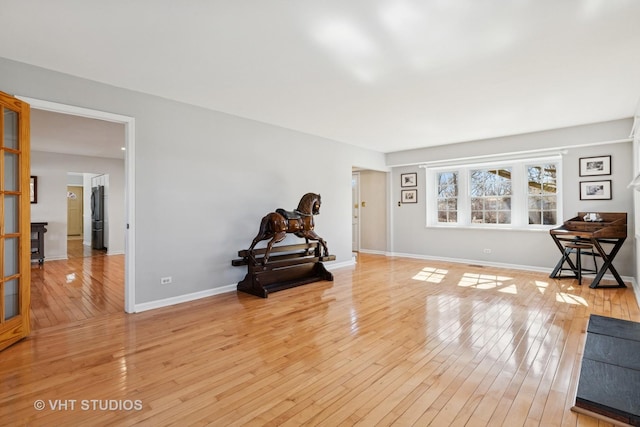 sitting room featuring light wood-style floors and baseboards