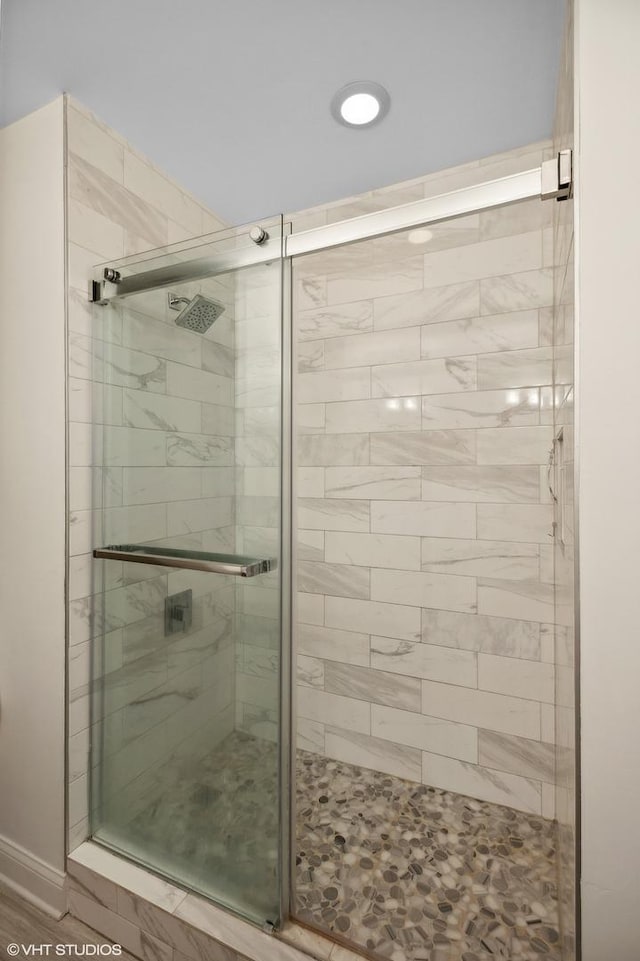 bathroom featuring an enclosed shower