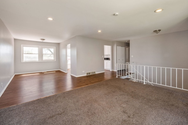 unfurnished room featuring dark hardwood / wood-style flooring