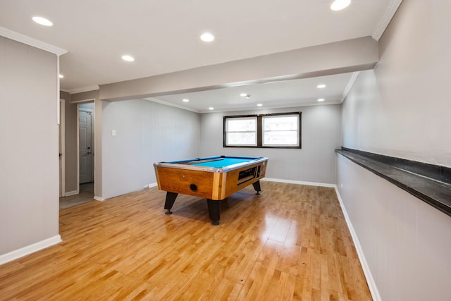 rec room featuring pool table, ornamental molding, and light wood-type flooring