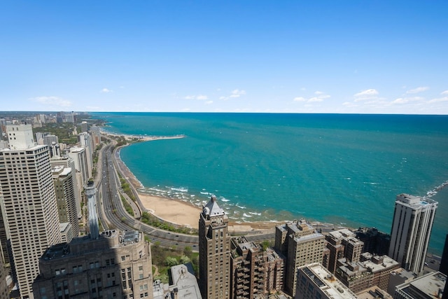 aerial view featuring a water view and a view of the beach