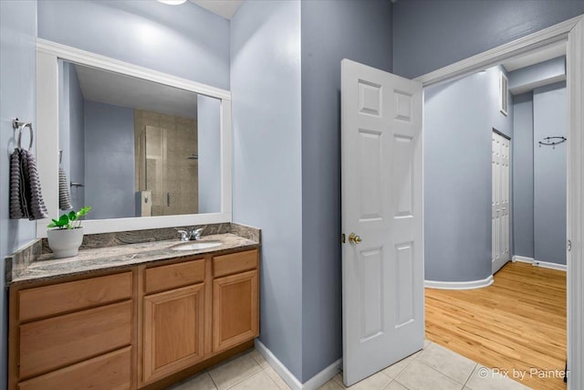 bathroom with vanity, tile patterned floors, and walk in shower