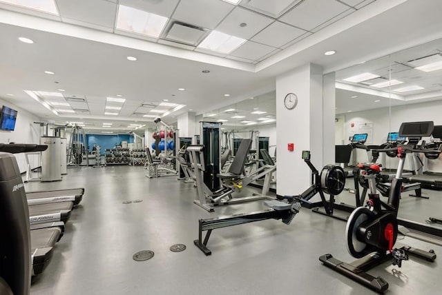 exercise room with a paneled ceiling